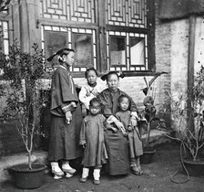 China: a Manchu lady with her daughter in-law and grandchildren, Beijing, 1869. Creator: John Thomson.