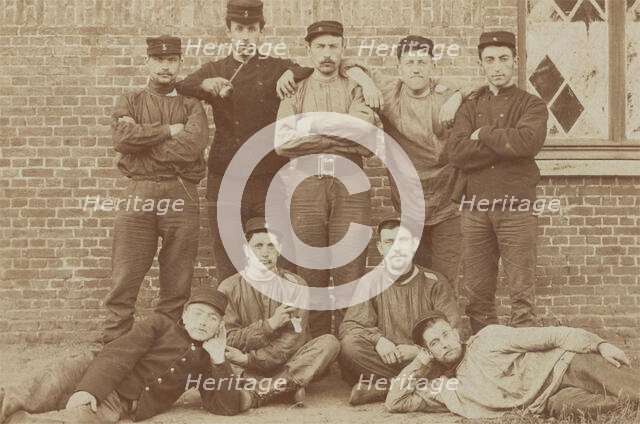 Belgian soldiers posing for a group portrait in a casual manner, 1908. Creator: Unknown.