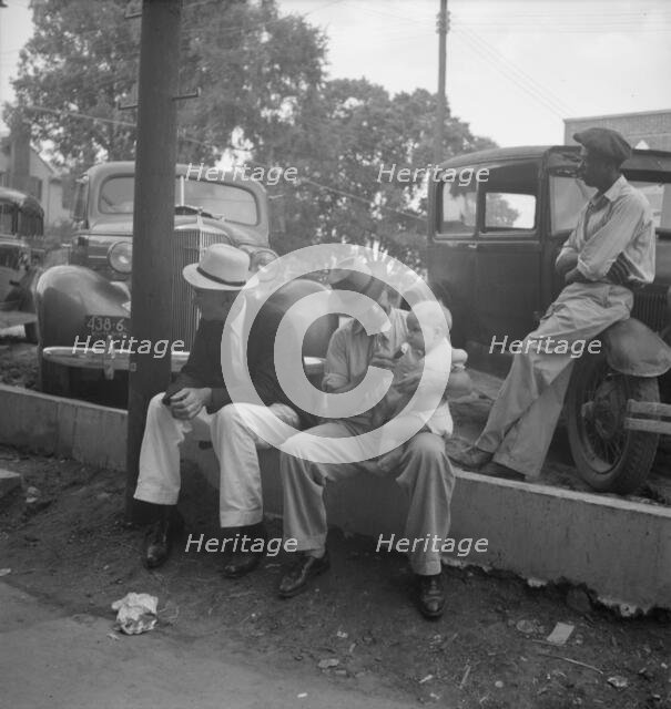 Chatham County farmers in town on Saturday afternoon, Pittsboro, North Carolina, 1939. Creator: Dorothea Lange.