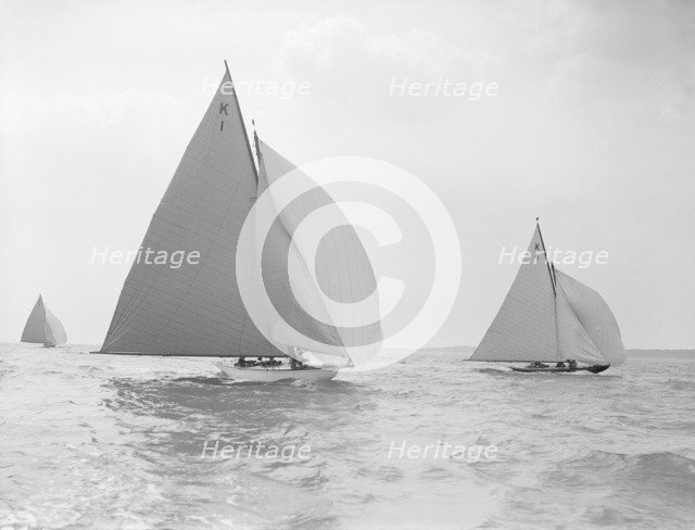 The 7 Metre 'Marsinah' (K1) and 'Anitra' (k4) racing downwind, 1912. Creator: Kirk & Sons of Cowes.
