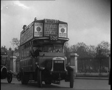 London Bus, Cars and Taxis Turning a Corner on a London Street , 1924. Creator: British Pathe Ltd.