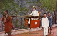 Man being carried on a Sedan chair, Hong kong, 20th century. Artist: Unknown