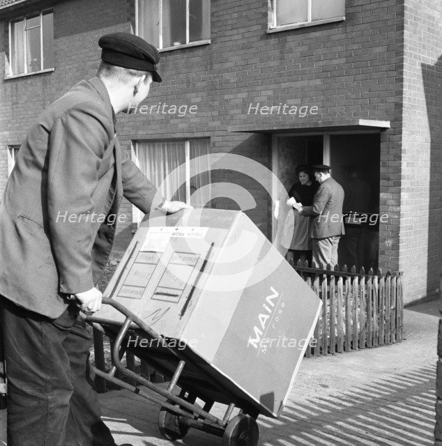 Home delivery of a cooker, Darfield, Barnsley, South Yorkshire, 1963. Artist: Michael Walters