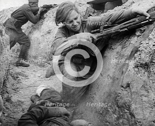 Two Russian Soldiers Taking Cover in a Trench, 1941. Creator: British Pathe Ltd.