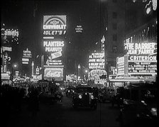 New York Times Square at Night Lit up By Lights, 1920s. Creator: British Pathe Ltd.