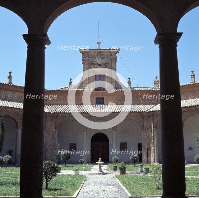 View through a round arch of the courtyard of the former Literary University of Huesca, which tod…