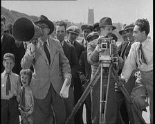 A Group of People Laughing as They Are Watch the Film Being Made from Behind a Camera, 1920s. Creator: British Pathe Ltd.