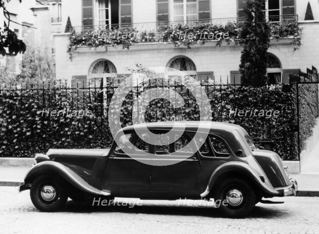1954 Citroën 15CV Familiale parked outside a house. Artist: Unknown