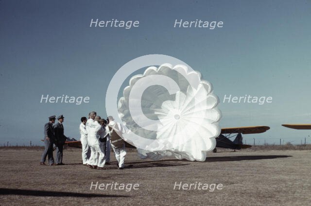 Instructor explaining the operation of a parachute to student pilots, Fort Worth, Tex., 1942. Creator: Arthur Rothstein.