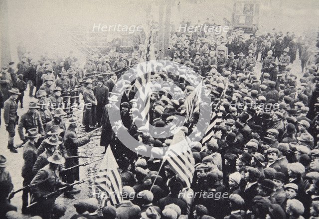 Armed troops confronting protesters during an industrial dispute, USA, 1912. Artist: Unknown