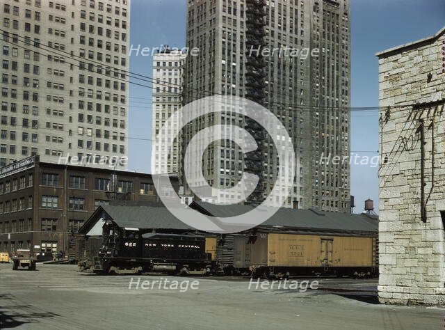 Diesel switch engine moving freight cars...South Water street...Illinois Central R.R., Chicago, 1943 Creator: Jack Delano.