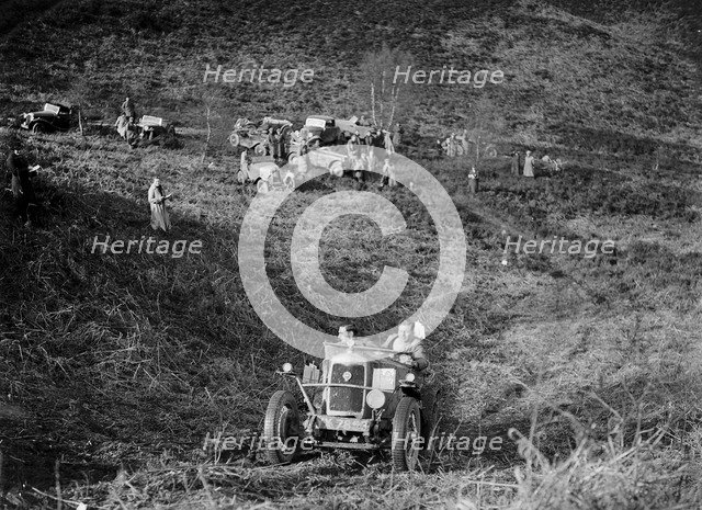 1089 cc Riley taking part in a motoring trial, late 1930s. Artist: Bill Brunell.