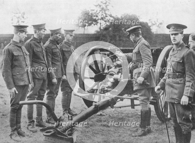 'Artillery recruits having the mechanism of an 18-pounder explained to them', 1915. Artist: Unknown.