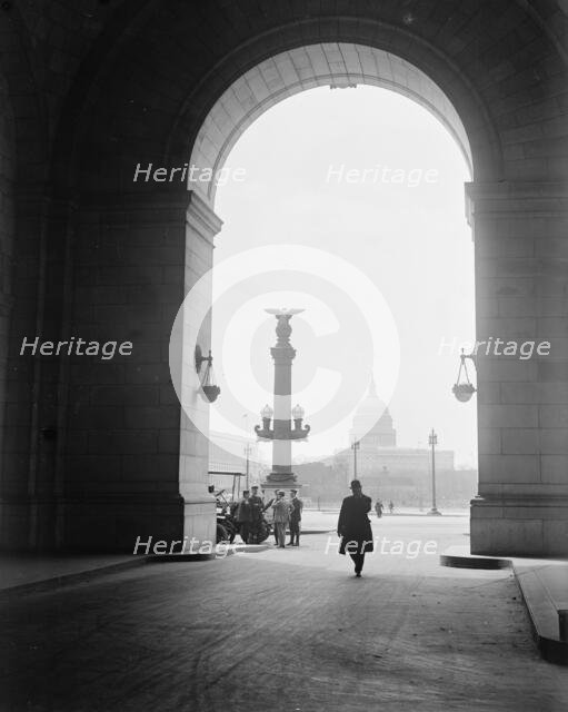 U.S. Capitol - View Through Arch At Union Station, 1917.  Creator: Harris & Ewing.