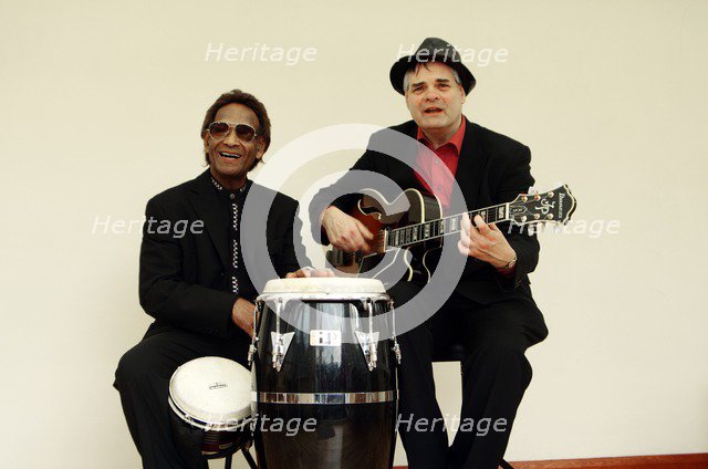 Frank Holder, Guyanan jazz singer and percussionist with Shane Hill, guitarist.   Artist: Brian O'Connor