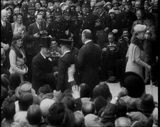 King George V and Other Well Dressed Men and Women Walking Through a Crowd with Photographers...1933 Creator: British Pathe Ltd.