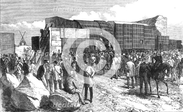 Experiments at Shoeburyness,...Plymouth Breakwater Target: examining the target after firing, 1868. Creator: C. R..