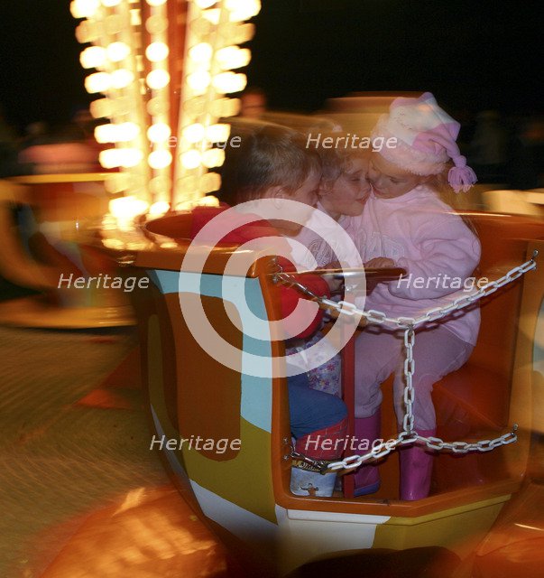 Children on a fairground ride, 2005 