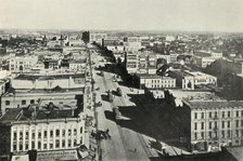 'Winnipeg To-Day; Looking Up Main Street. - The Rapid Growth of Modern Canada', c1930. Creator: Valentine & Sons Ltd.