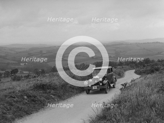 Riley Monaco saloon of VJ Fishleigh competing in the MCC Torquay Rally, 1938. Artist: Bill Brunell.