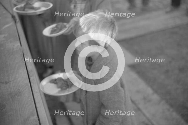 Possibly: Negroes in the lineup for food at mealtime in the camp..., Forrest City, Arkansas, 1937. Creator: Walker Evans.