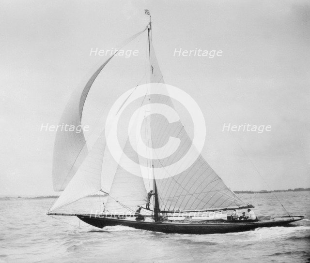 Unknown cutter sailing with spinnaker. Creator: Kirk & Sons of Cowes.