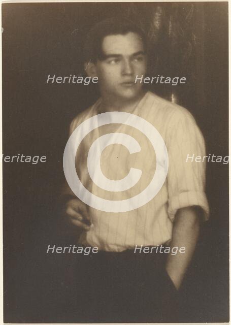 Portrait of a Young Man in Striped Shirt with Cigarette, 1907-1924. Creator: Louis Fleckenstein.