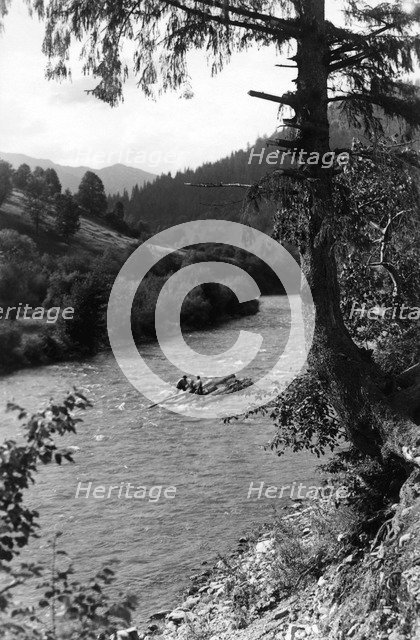 Floating tree trunks down the river, Bistrita Valley, Moldavia, north-east Romania, c1920-c1945. Artist: Adolph Chevalier