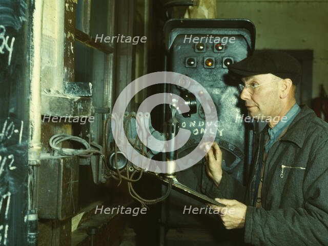 Hump master in a Chicago and North Western railroad yard operating a signal..., Chicago, Ill., 1942. Creator: Jack Delano.