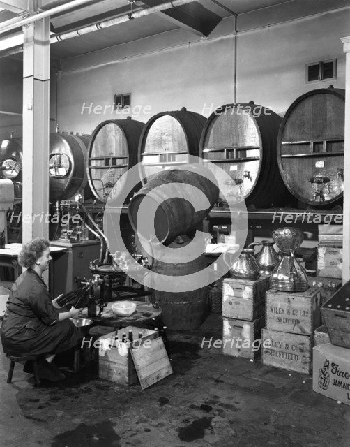 Whisky blending at Wiley & Co, Sheffield, South Yorkshire, 1960. Artist: Michael Walters