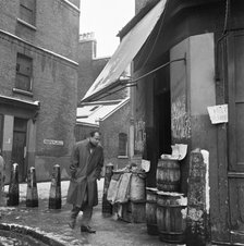 A winter's day in Frostic Place, Stepney, London, c1946-c1959. Artist: John Gay