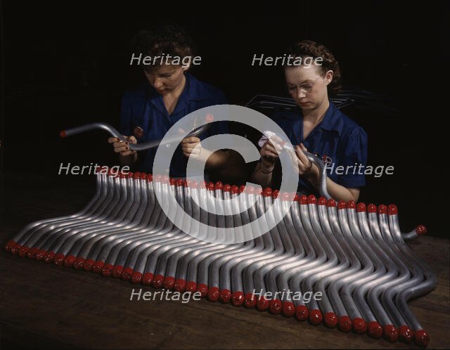 Capping and inspecting tubing: two women are shown...at Vultee's Nashville division, Tennessee, 1943 Creator: Alfred T Palmer.
