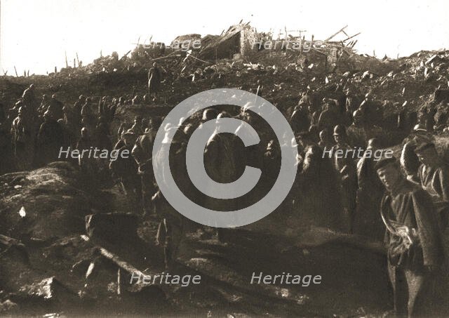 In Recaptured Territory; The evening of October 23, 1917: gathering German prisoners,... 1917. Creator: Unknown.