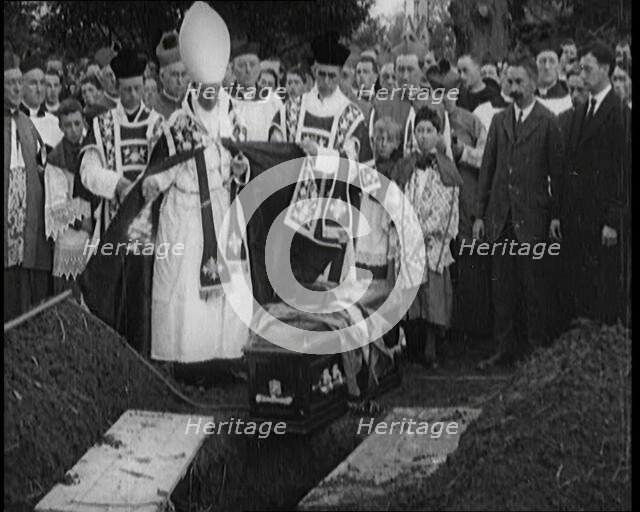 A Priest Waving Incense Over the Coffin of Terence MacSwiney During His Burial, 1920. Creator: British Pathe Ltd.