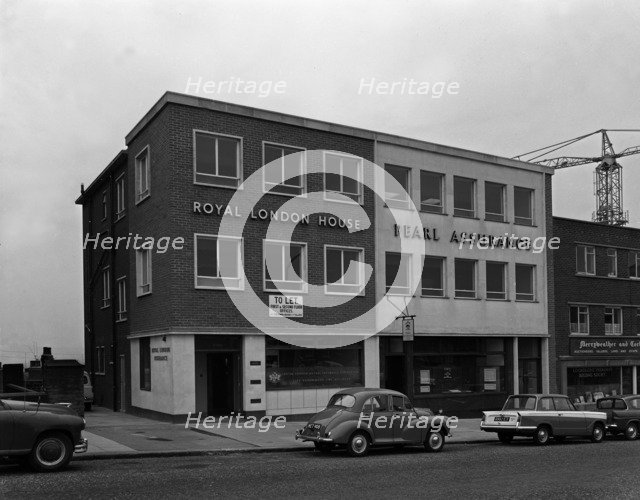 Morris Minor and a Triumph Herald outside the Royal Insurance Building, Rotherham, S Yorks, 1962. Artist: Michael Walters