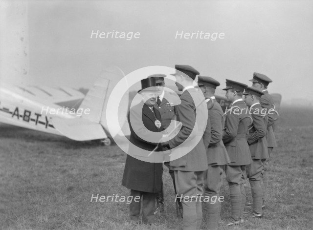 Visiting dignitary meeting airmen at Heston Aerodrome, Hounslow, London, c1933-c1935. Creator: Aerofilms.