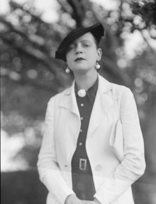 Leonard, Mrs., standing outdoors, between 1926 and 1938. Creator: Arnold Genthe.