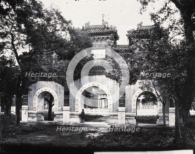 Hall of Classics (Guozijian), Peking: a triple archway of sculpted marble leading... 1871, (1981). Creator: Unknown.