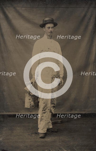 Painter in Paint-spattered Overalls with Brushes and Paint Can, 1870s-80s. Creator: Unknown.