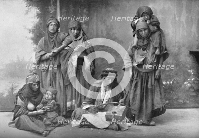 A Bedouin musician and his audience, 1902. Artist: Unknown.