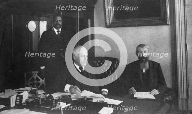 Three men in office in Bureau of Engraving and Printing, Washington, D.C., 1889 or 1890. Creator: Frances Benjamin Johnston.