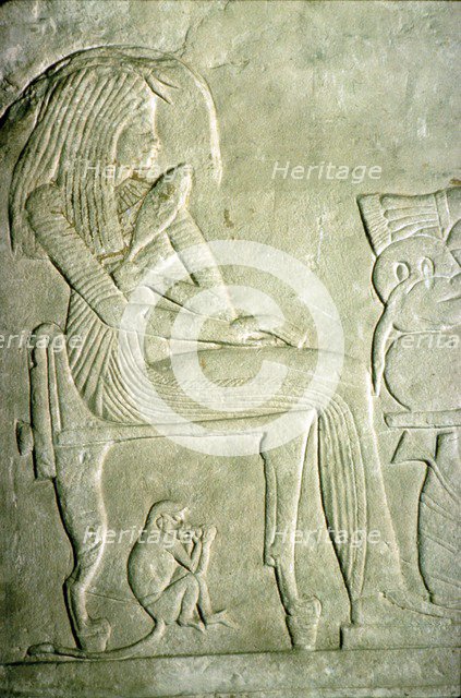 Egyptian Relief. Seated Lady with elaborate hairstyle.  Artist: Unknown.