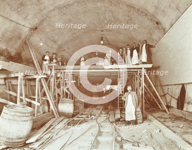 Workmen tiling the Rotherhithe Tunnel, London, December 1907. Artist: Unknown.