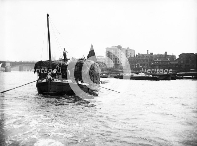 Dumpy barge on the Thames loaded with hay or esparto, London, c1905. Artist: Unknown