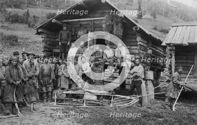 Group of Shoria Men; a Hunter, in Front, Equipped for a Winter Hunt by the Members..., 1913. Creator: GI Ivanov.