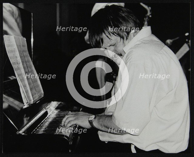 Geoff Eales playing the piano at The Fairway, Welwyn Garden City, Hertfordshire, 11 March 2001. Artist: Denis Williams