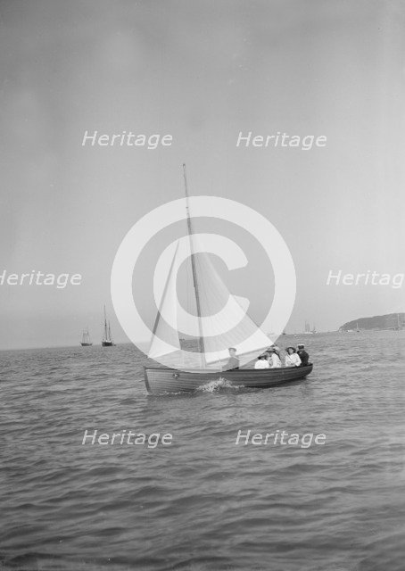 Party sailing on the Earl of Normanton's Cutter, 1911. Creator: Kirk & Sons of Cowes.
