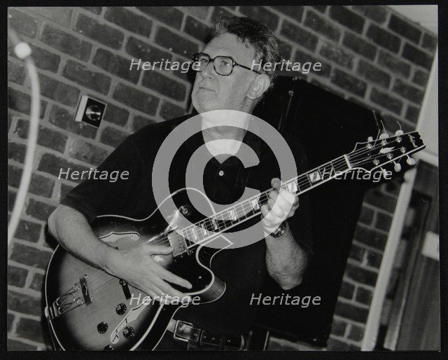 Jim Mullen playing guitar at The Fairway, Welwyn Garden City, Hertfordshire, 3 August 1997. Artist: Denis Williams
