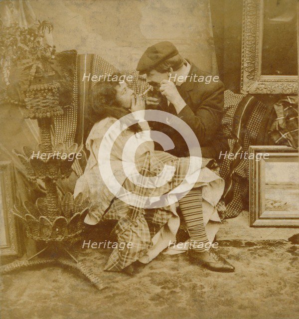 Couple lighting a cigarette from each other, 1900. Artist: Unknown