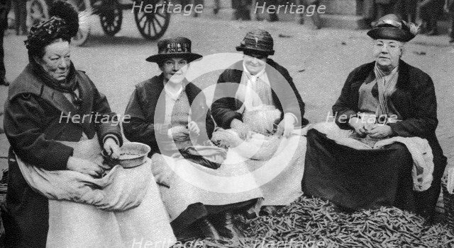 Pea shelling in Covent Garden, London, 1926-1927. Artist: Unknown